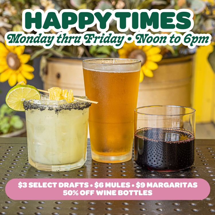 Happy Hour drinks at Bareburger featuring a margarita with a lime garnish, a pint of draft beer, and a glass of red wine on an outdoor table surrounded by bright sunflowers. Promotional text reads: Happy Times, Monday thru Friday, Noon to 6pm — $3 select drafts, $6 mules, $9 margaritas, and 50% off wine bottles